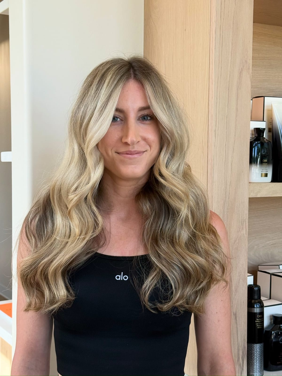 Finished lived-in blonde — long waves, fresh out of the chair