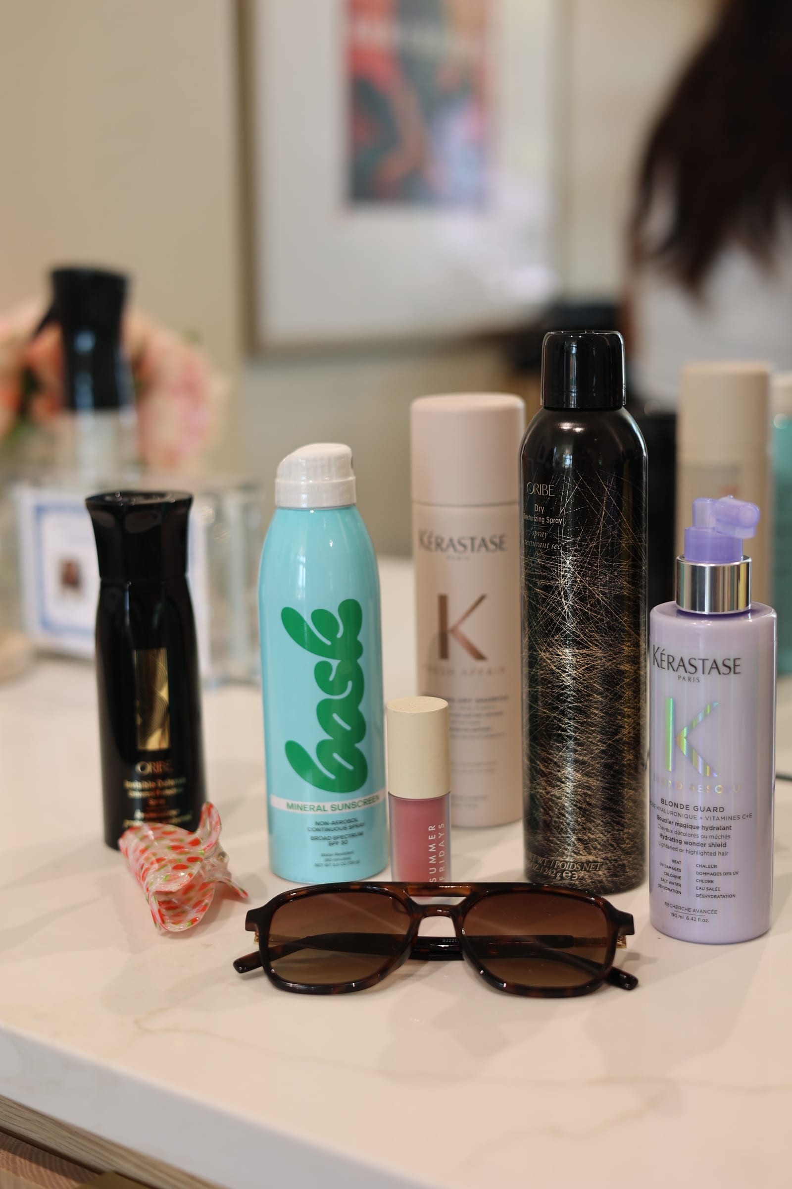 Product flat-lay with sunglasses — the take-home shelf, studied