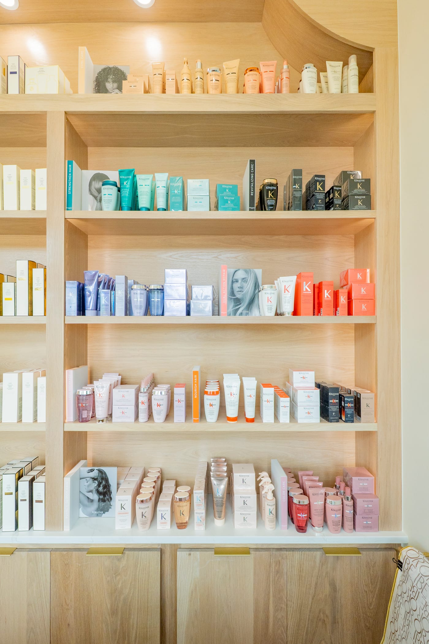 The retail shelves stocked floor to ceiling with Kérastase and house products